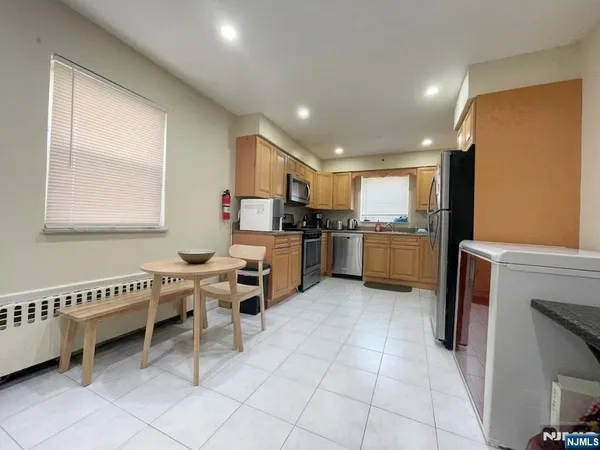 a bathroom with a double vanity sink and a bathtub