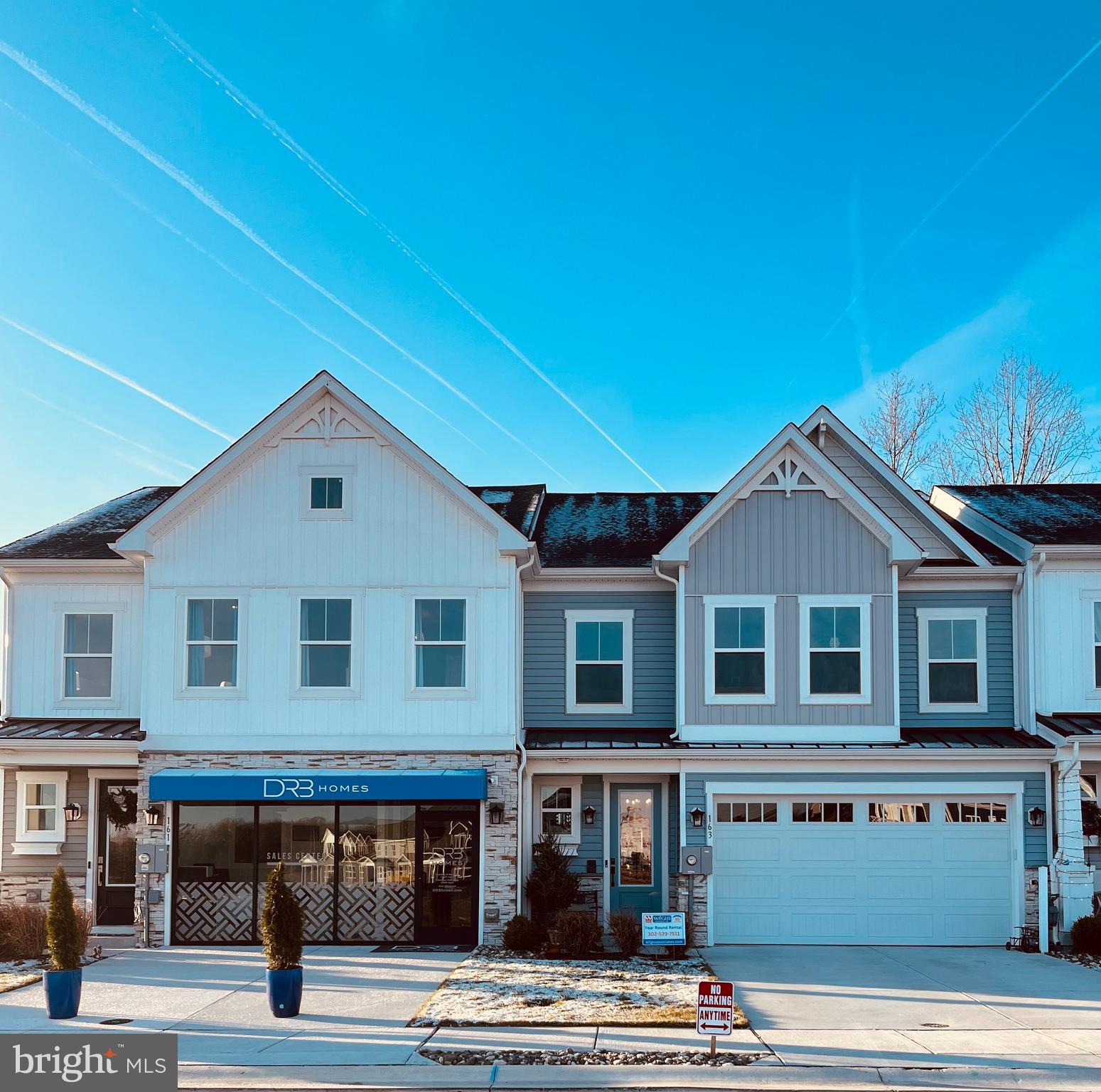 a front view of a building with parking space