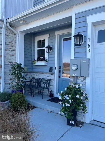 a flower garden in front of the door