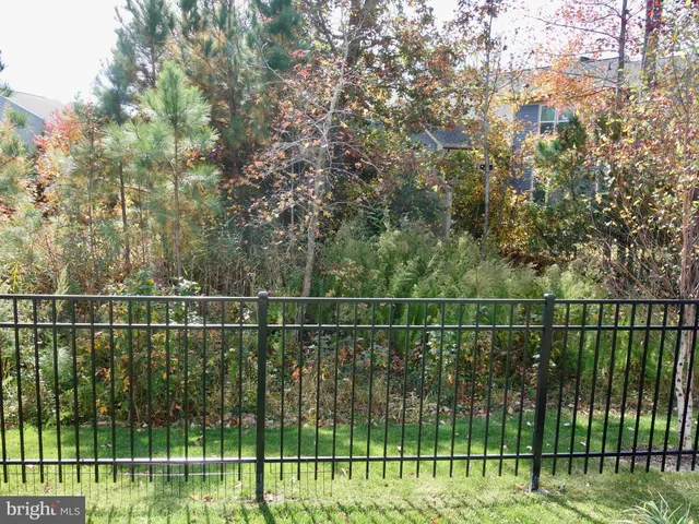 a view of a fence and a bridge