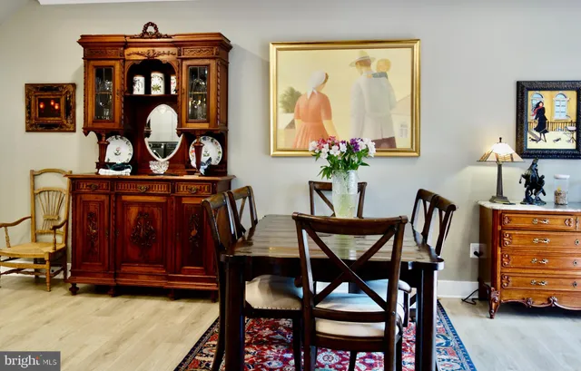 a view of a dining room with furniture and chandelier