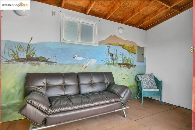 a living room with furniture and a table