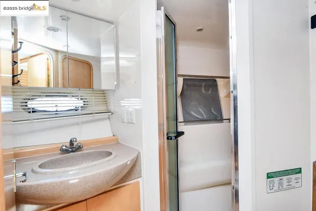 a bathroom with a sink and mirror