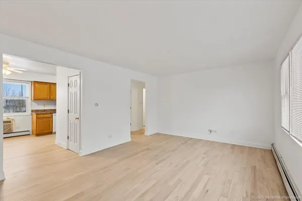 an empty room with a bathroom and a sink