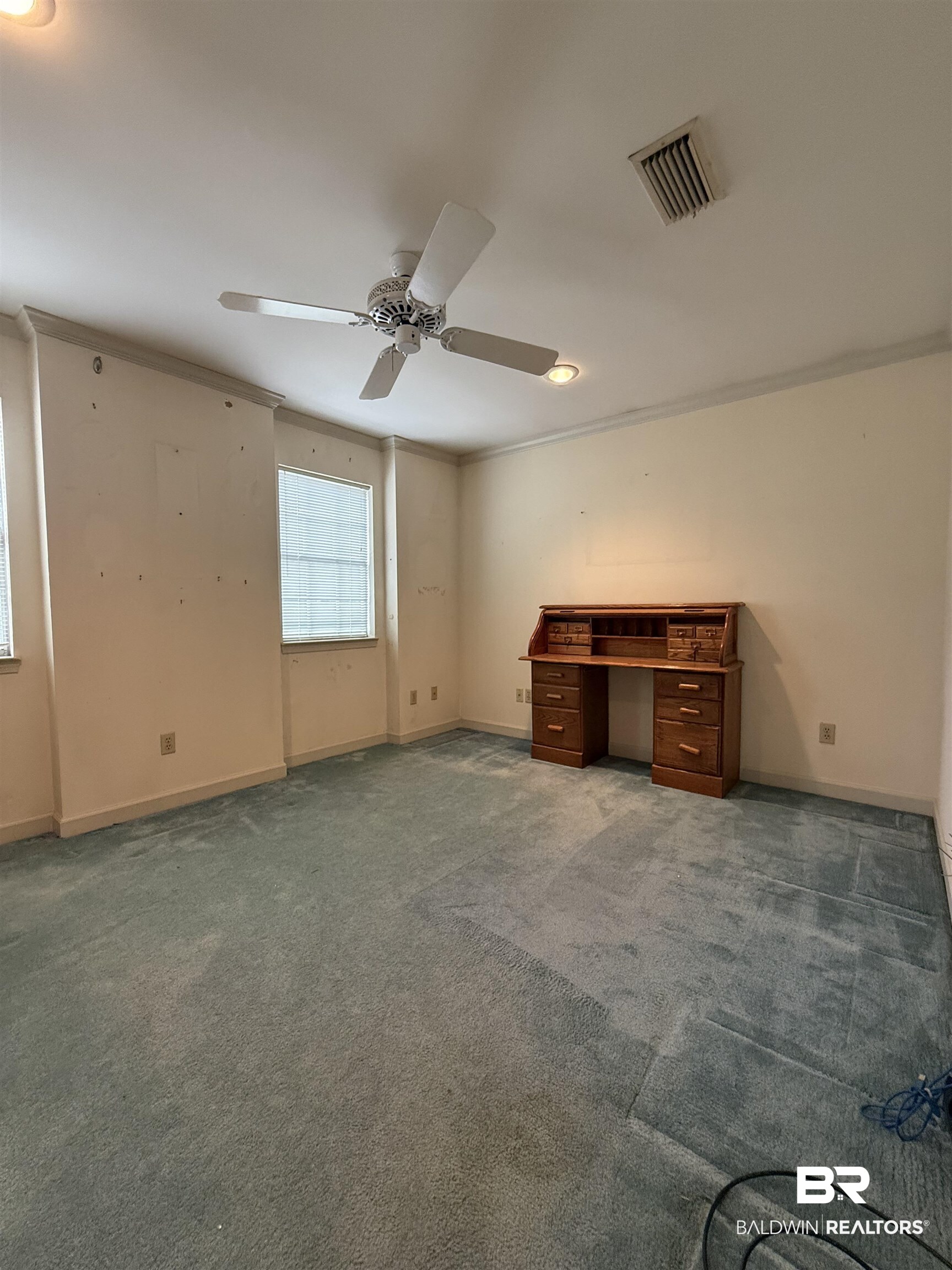 295 Norwood Road Monroeville, AL 36460 - Photo 18 of 32 Unfurnished bedroom featuring crown molding, carpet floors, baseboards, and ceiling fan