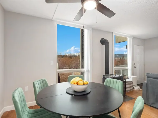 a view of a dining room with furniture and window