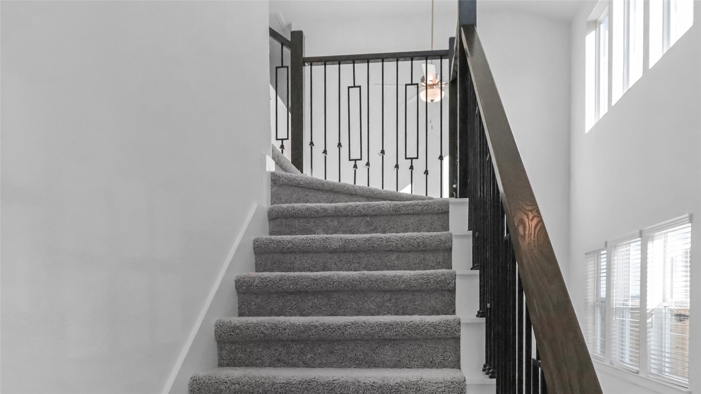 6635 Escondido Drive Rosharon, TX 77583 - Photo 20 of 28 a view of staircase with white walls and a window