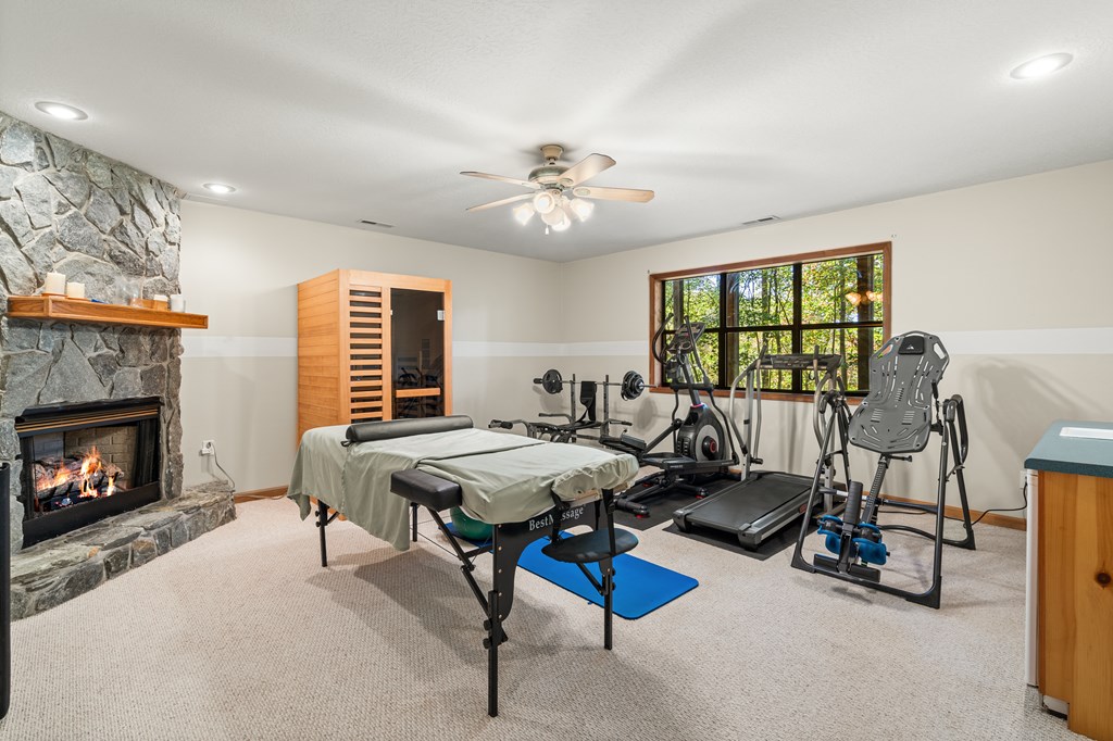 230 Pinners Point Hayesville, NC 28904 - Photo 22 of 35 a living room with furniture a fireplace and a flat screen tv
