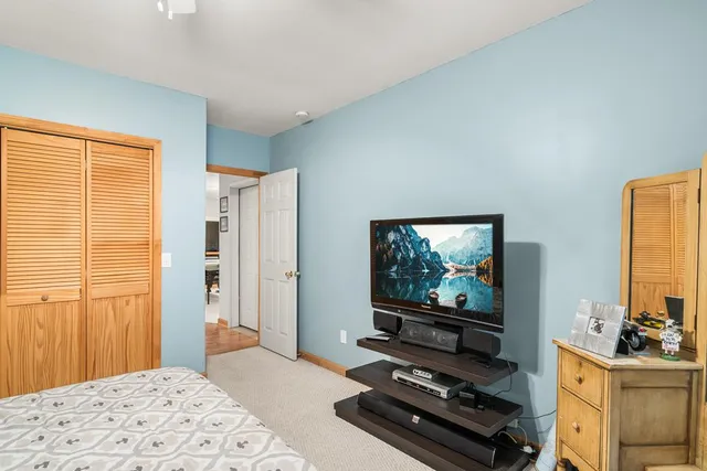 a room with window and flat screen tv