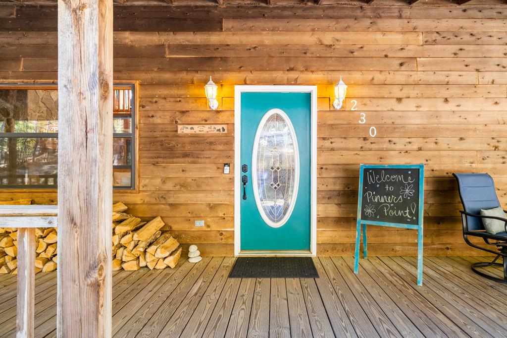 230 Pinners Point Hayesville, NC 28904 - Photo 4 of 35 a view of a wooden door with a glass door