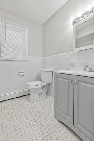 a bathroom with a toilet and a sink