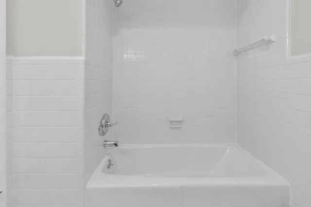 a close view of a bathtub in bathroom