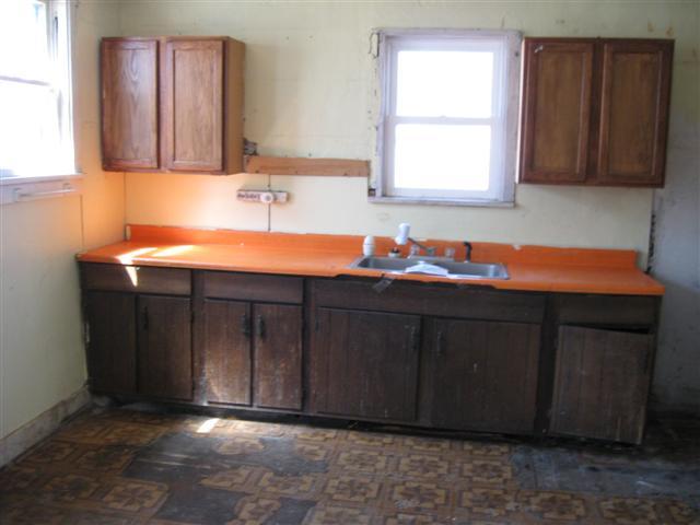922 East Shawnee Street Freeport, IL 61032 - Photo 2 of 9 a bathroom with a sink vanity and mirror