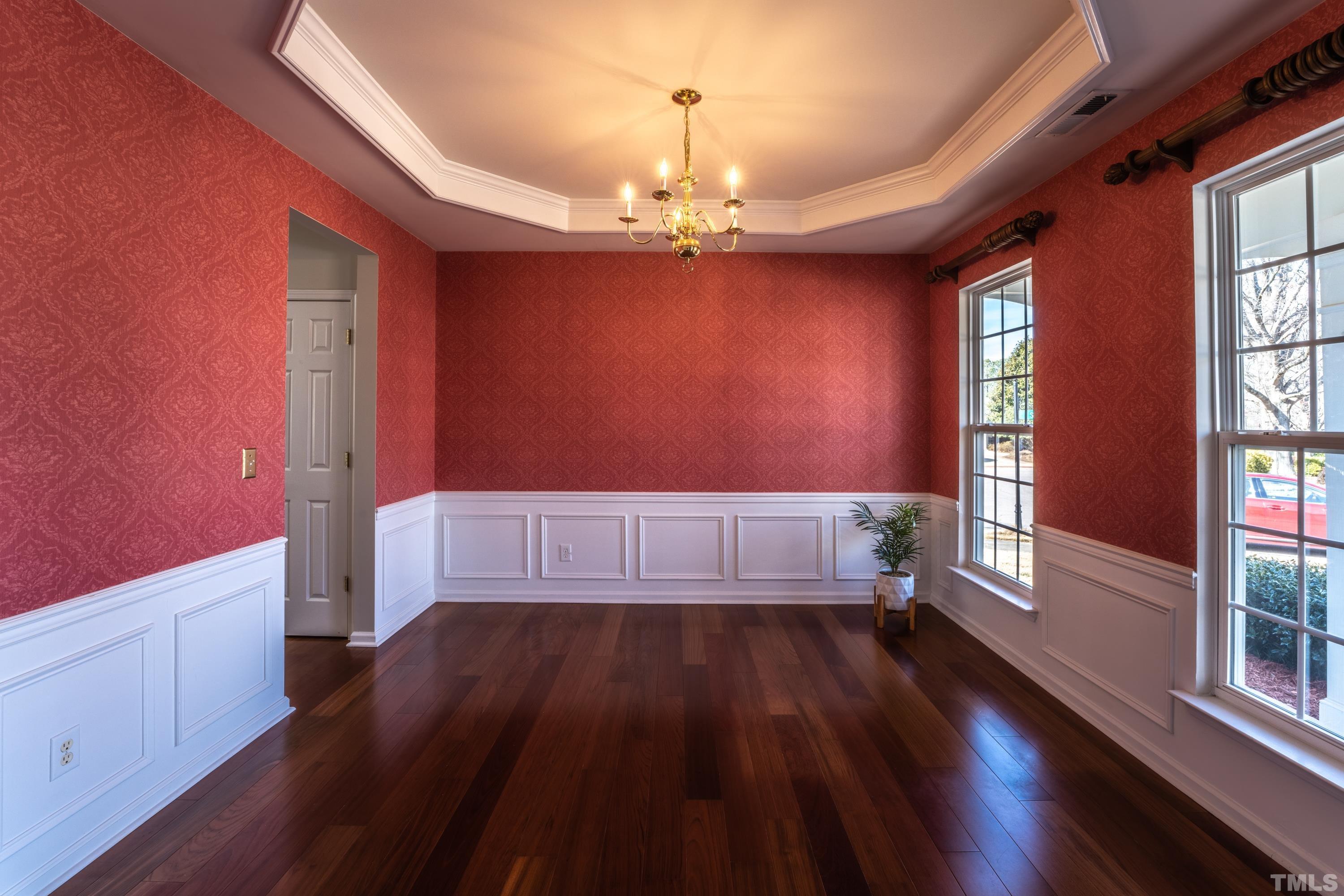 5455 Wind Mountain Lane Raleigh, NC 27613 - Photo 4 of 28 a view of empty room with wooden floor and fan