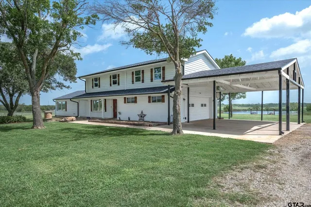 a living room with fireplace furniture and a flat screen tv