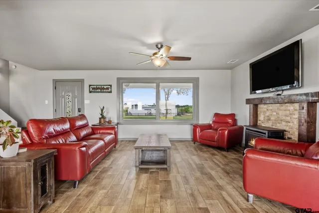 a living room with furniture and a flat screen tv