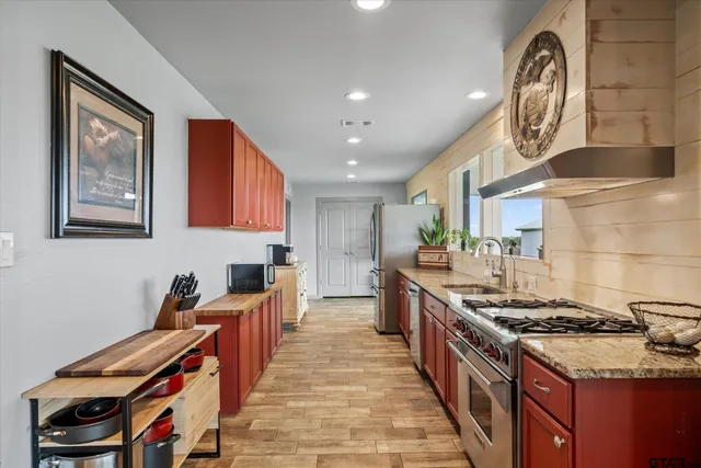 a kitchen with a stove and a sink
