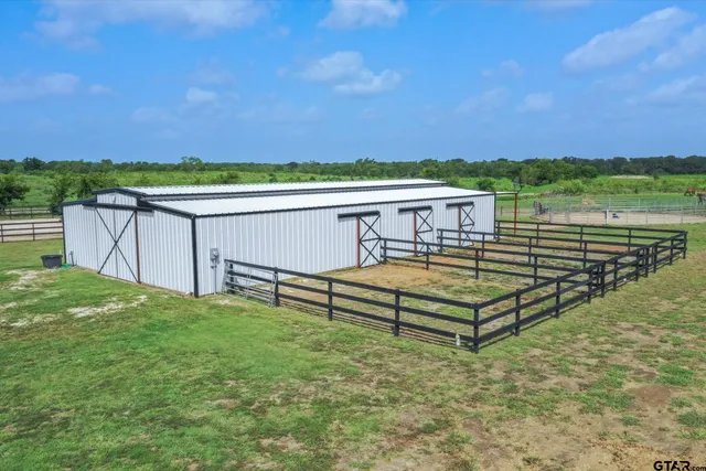 a view of empty room with wooden ceiling