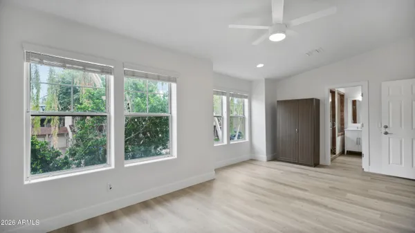 a kitchen with granite countertop white cabinets and appliances