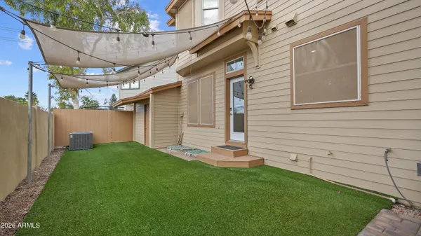 a backyard of a house with seating space