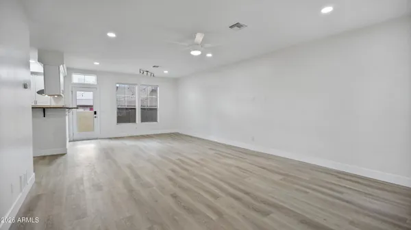 a view of a kitchen with a sink and a window