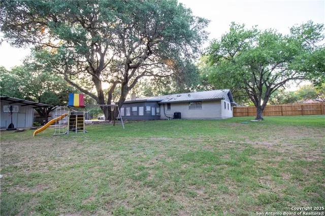 a view of a park with swings