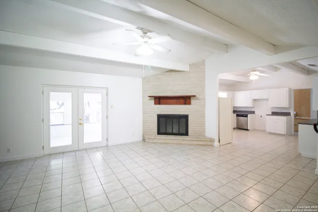 a view of an empty room and window