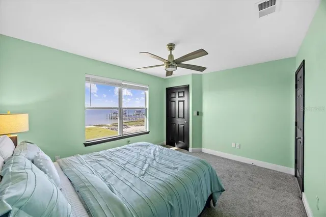 a view of a swimming pool and an outdoor seating