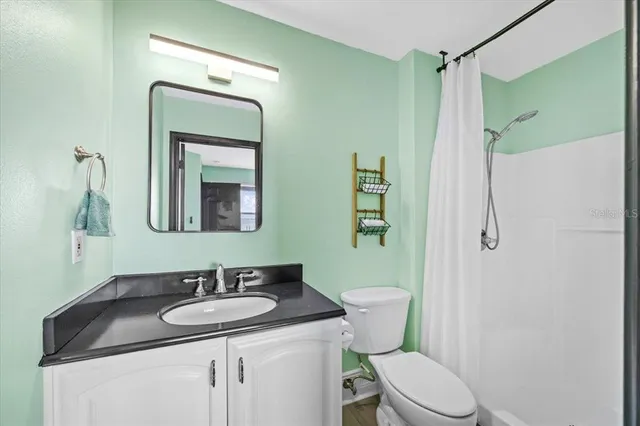 a front view of a house with swimming pool and a yard