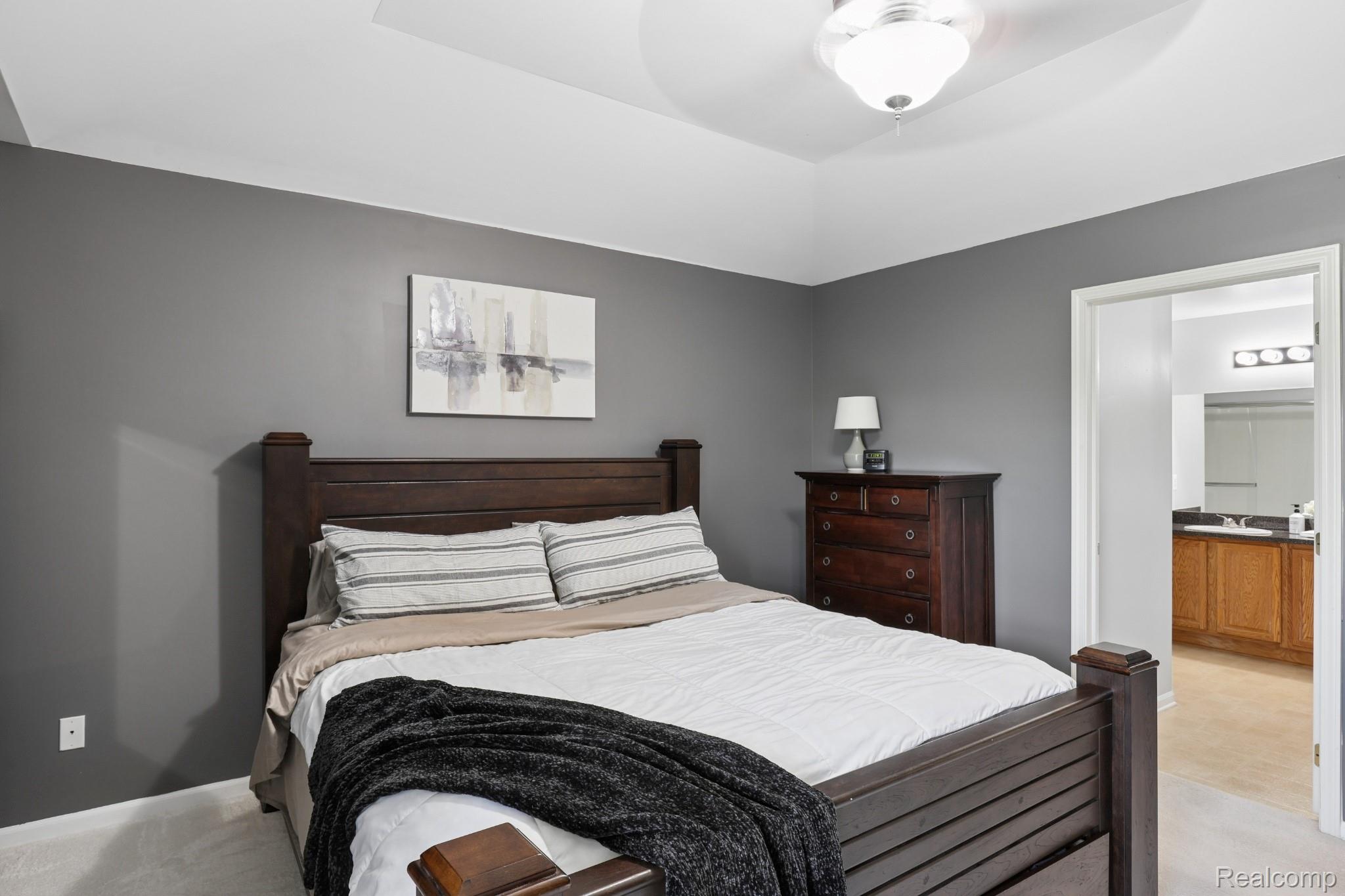 11862 Farmington Road Livonia, MI 48150 - Photo 7 of 29 Bedroom featuring a tray ceiling, recessed lighting, and a ceiling fan