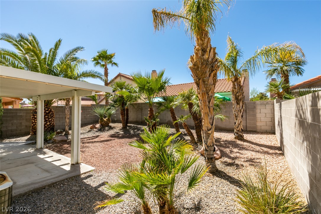 307 Cavalla Street Henderson, NV 89074 - Photo 43 of 44 A private, low-maintenance outdoor space featuring a covered patio and desert-friendly landscaping.