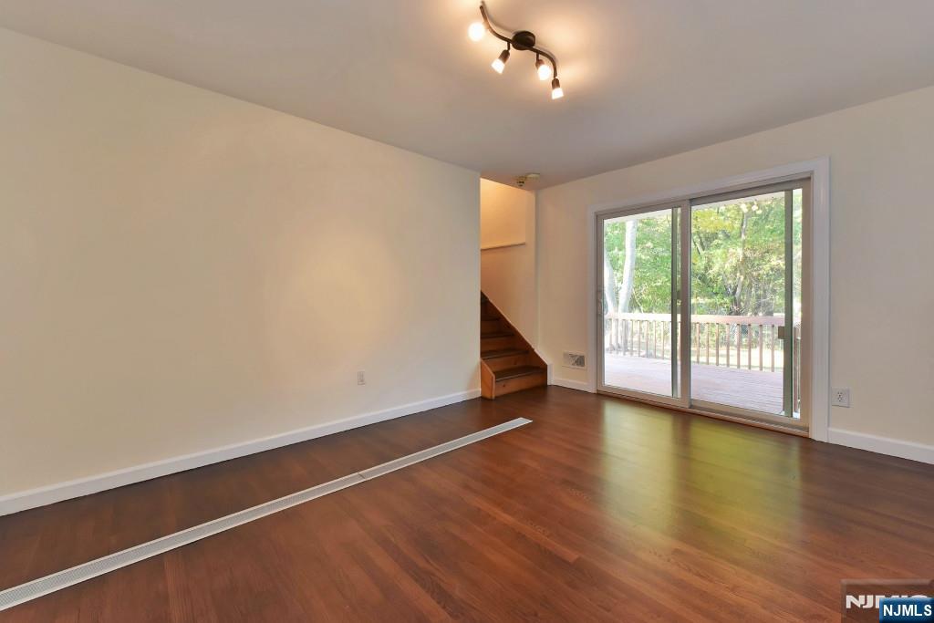 4 Marconi Street Tenafly, NJ 07670 - Photo 23 of 35 a view of an empty room with wooden floor and a window