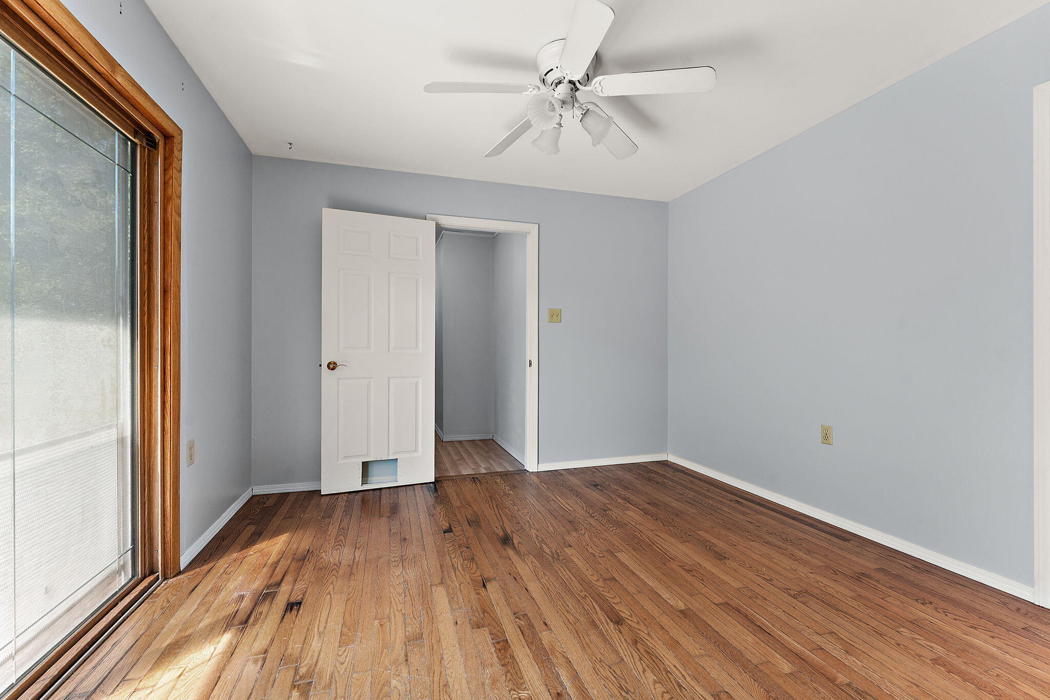 739 Eagle Creek Road Valparaiso, IN 46385 - Photo 12 of 23 wooden floor in an empty room with a window