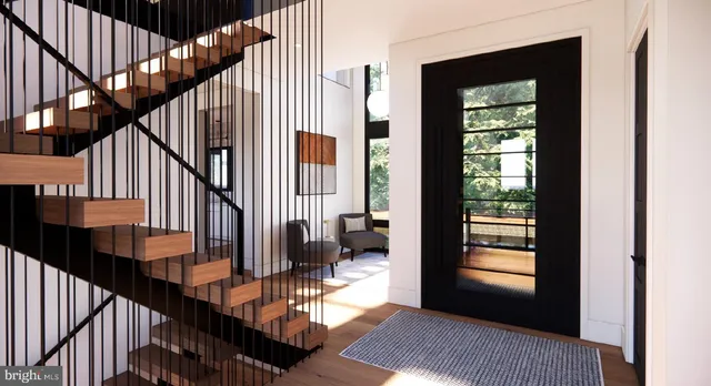a view of staircase with railing and black white walls