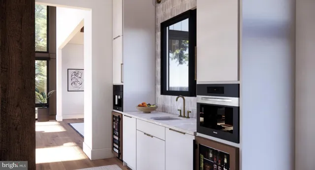 a living room with furniture and large windows