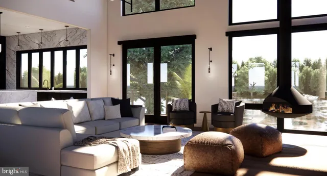 a living room with furniture and floor to ceiling window