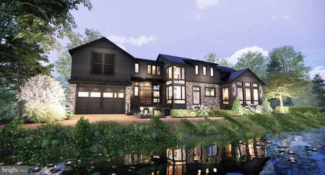 a front view of a house with a yard table and chairs