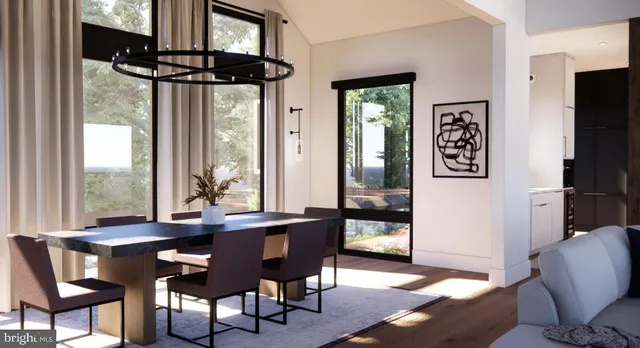 a living room with furniture a dining table and a large window