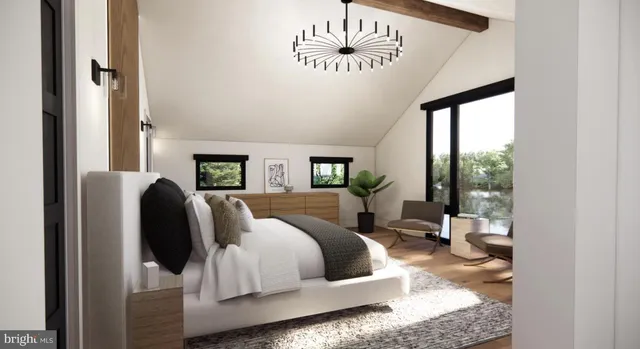 a bedroom with furniture and a large window