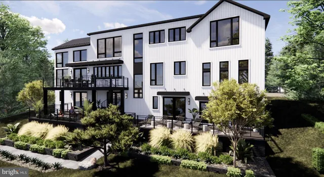 a house with lots of trees in the background