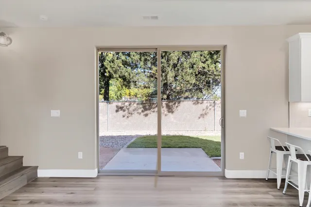 a view of a house with a wooden fence