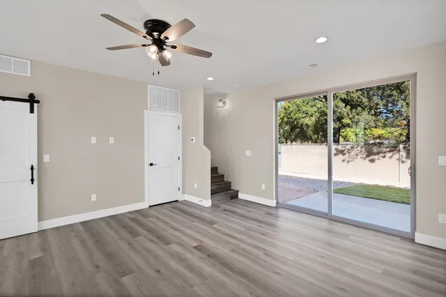 a view of an empty room with a window
