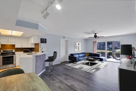 a living room with furniture flat screen tv and a fireplace