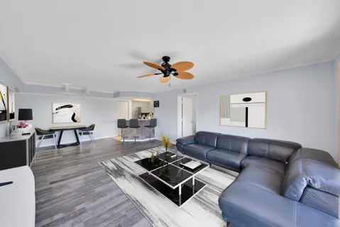 a living room with furniture and a rug