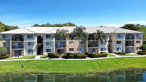 a front view of a house with a yard table and chairs