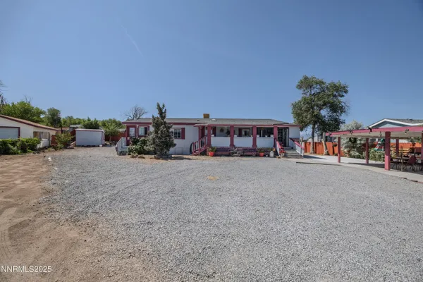 a view of house with outdoor space and sitting area