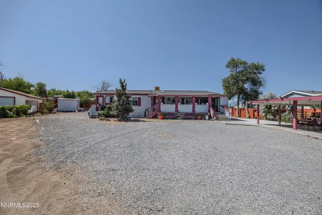 a view of house with outdoor space and sitting area