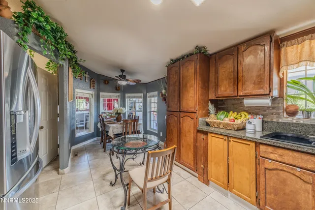 a view of a dining room with furniture and a chandelier