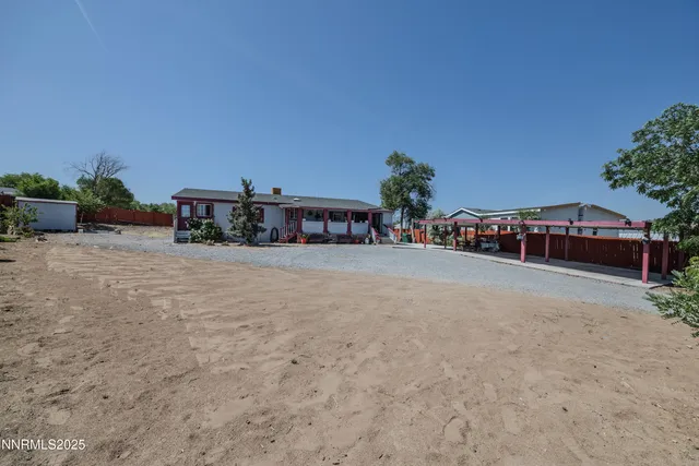 a view of a cars park in front of house