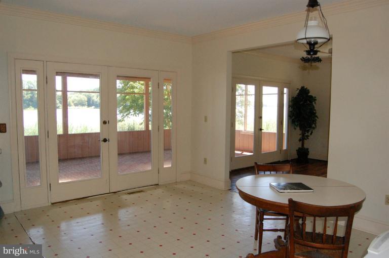 6937 Pea Neck Road St. Michaels, MD 21663 - Photo 15 of 22 a view of a livingroom with furniture and window